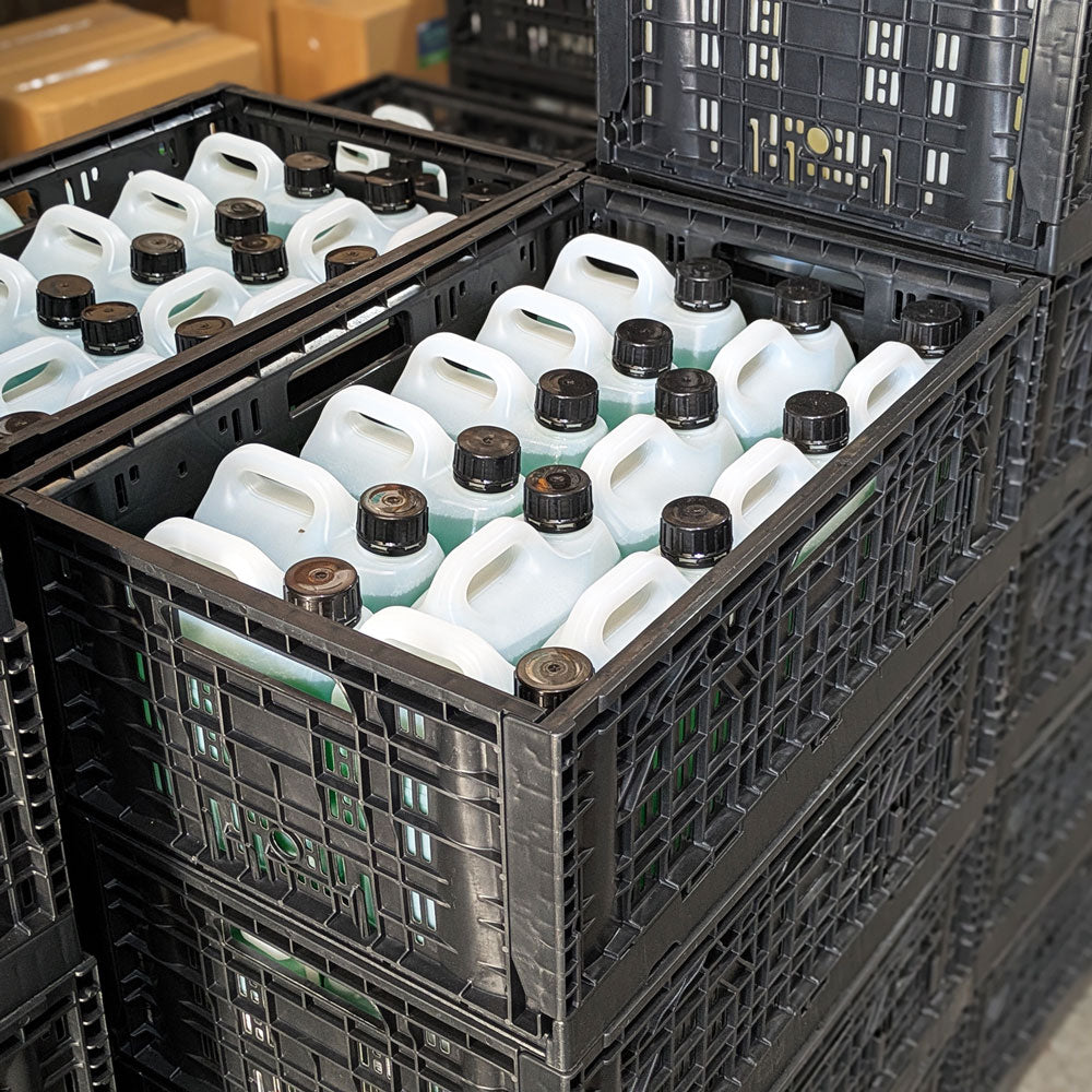 crates stacked filled with bottles for storage on pallets