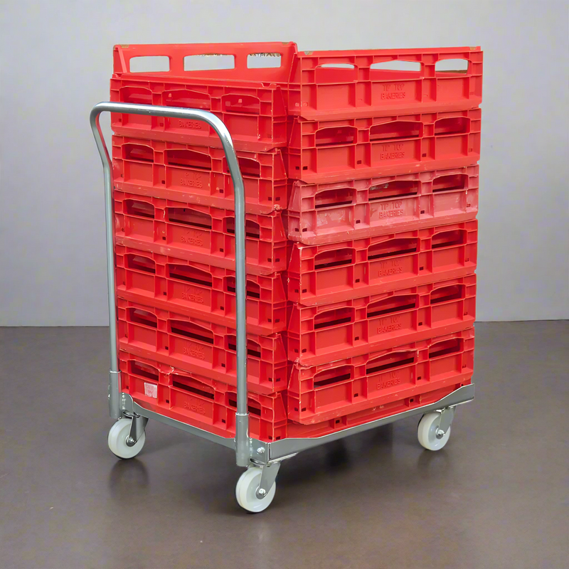 steel metal bread crate dollie loaded with bread crates in back of backery
