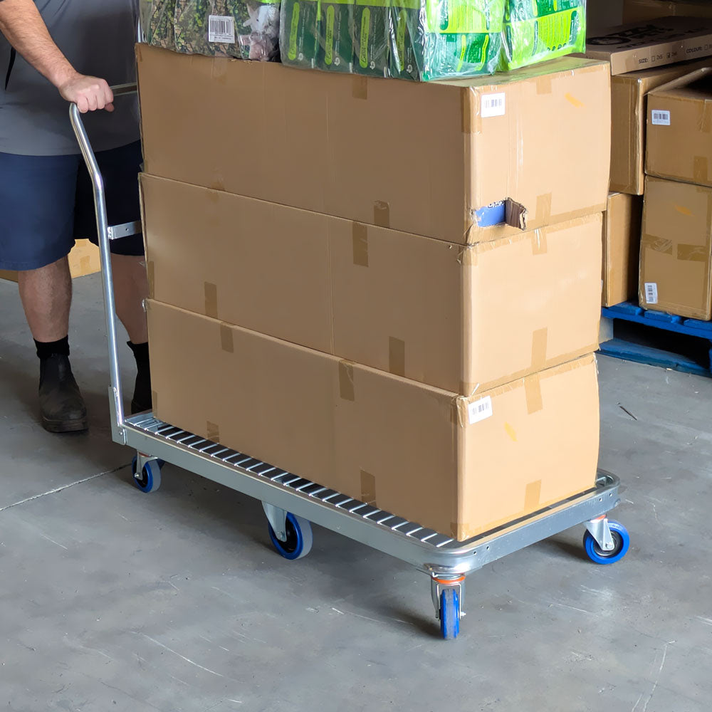 6 wheel warehouse trolley loaded with cartons and goods