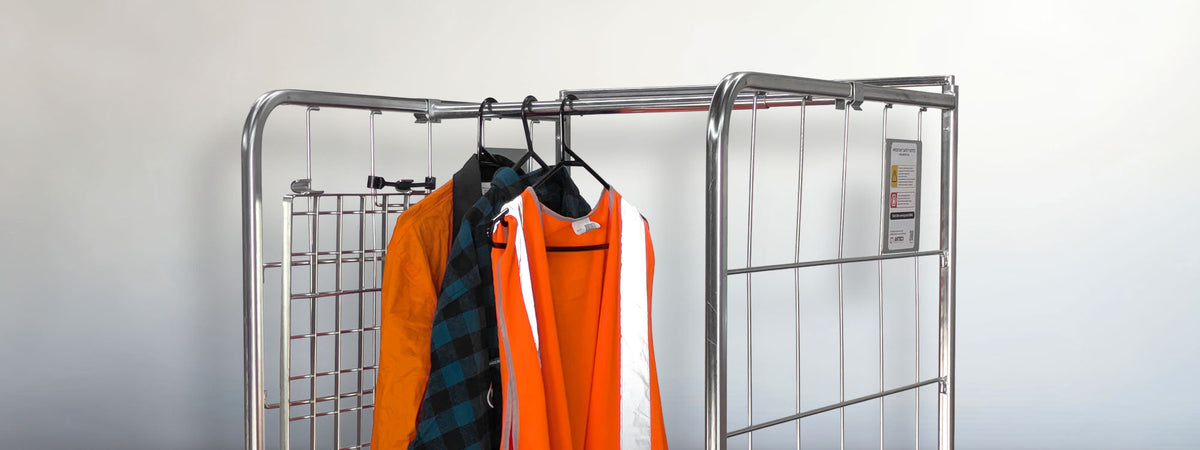 clothes hanging in roll cage