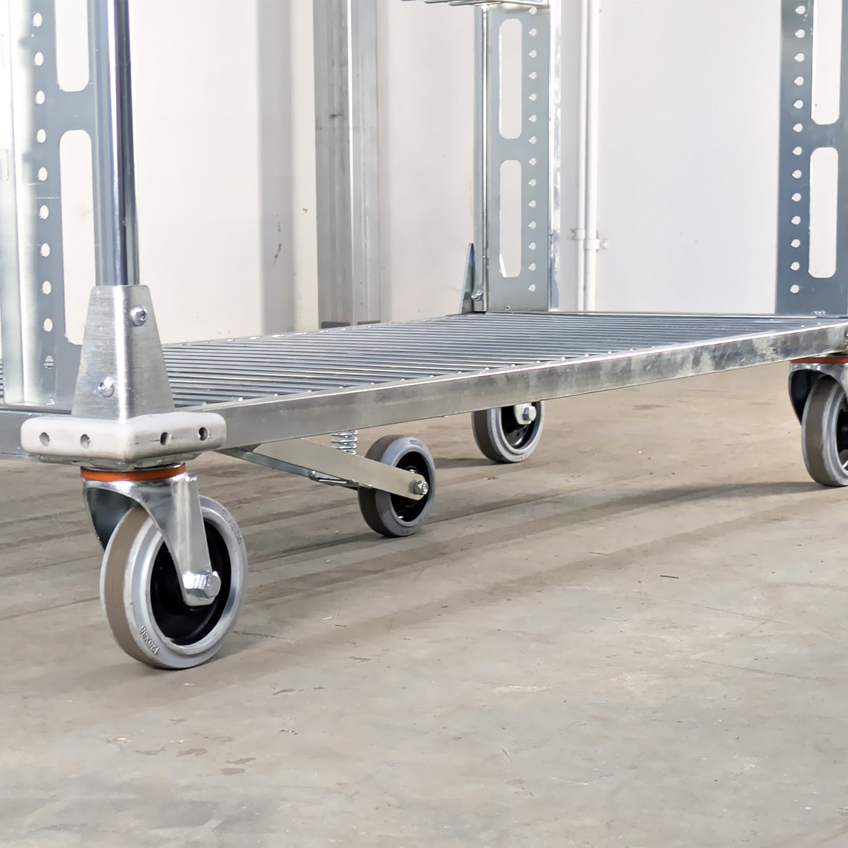 Metal platform truck with wheels on a concrete floor
